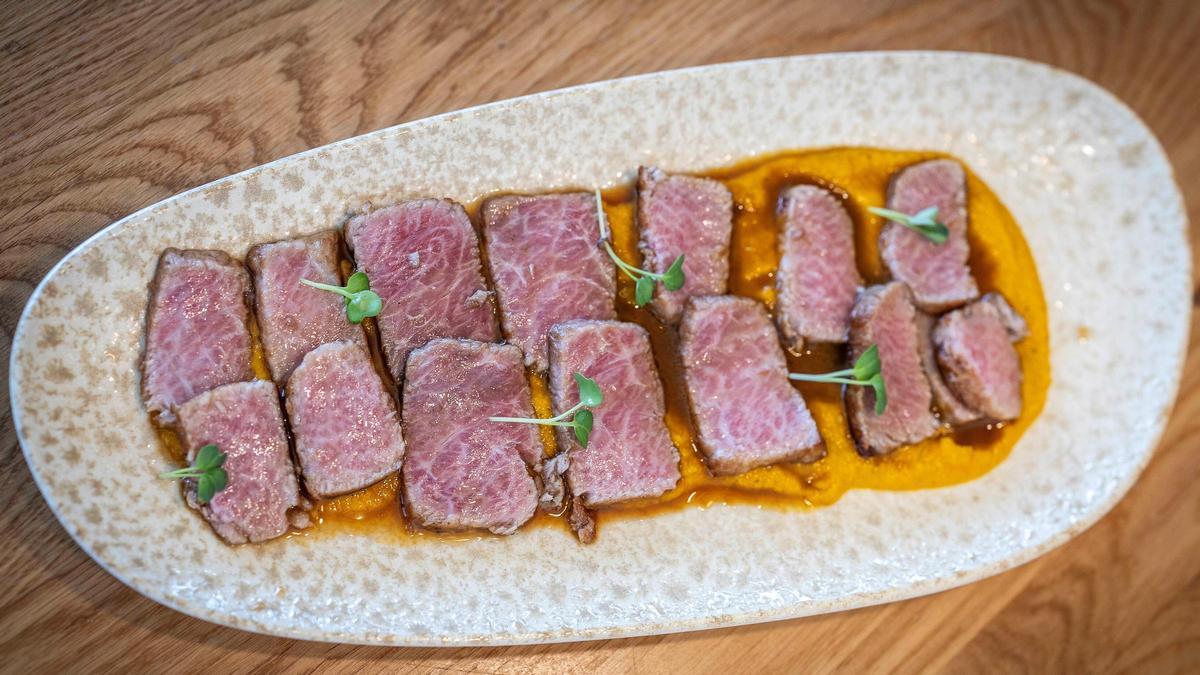 La ventresca aderezada con una crema de zanahoria en escabeche y comino del restaurante El Tribut.