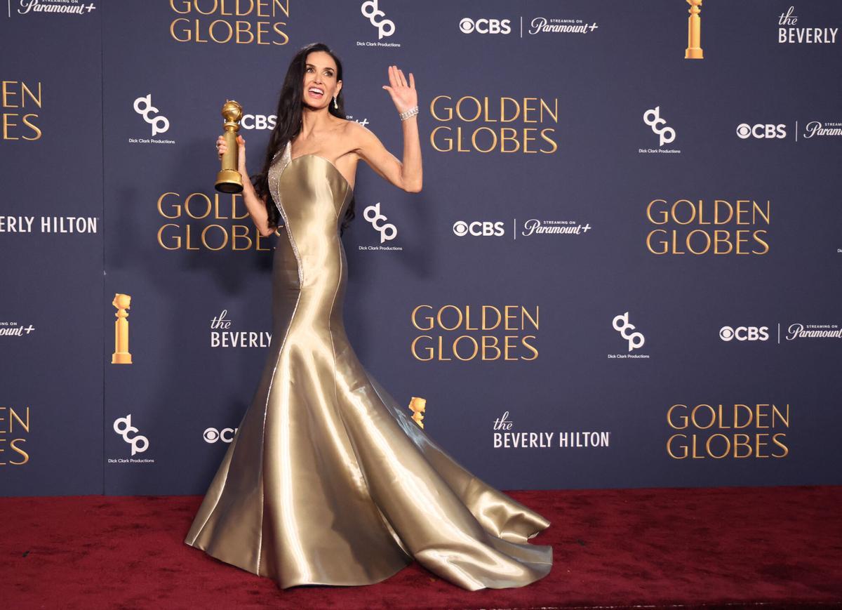 Demi Moore poses with the award for Best Performance by an Actress in a Motion Picture - Musical or Comedy, for The Substance, at the 82nd Golden Globe Awards in Beverly Hills, California, U.S., January 5, 2025. REUTERS/Mario Anzuoni