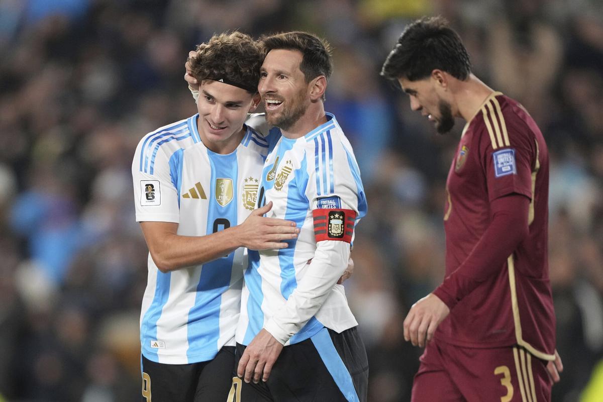 Argentina's Lionel Messi, center, celebrates with Julian Alvarez after scoring his side's opening goal against Venezuela during a World Cup 2026 qualifying soccer match at the Monumental stadium in Buenos Aires, Argentina, Thursday, Sept. 4, 2025. (AP Photo/Natacha Pisarenko)