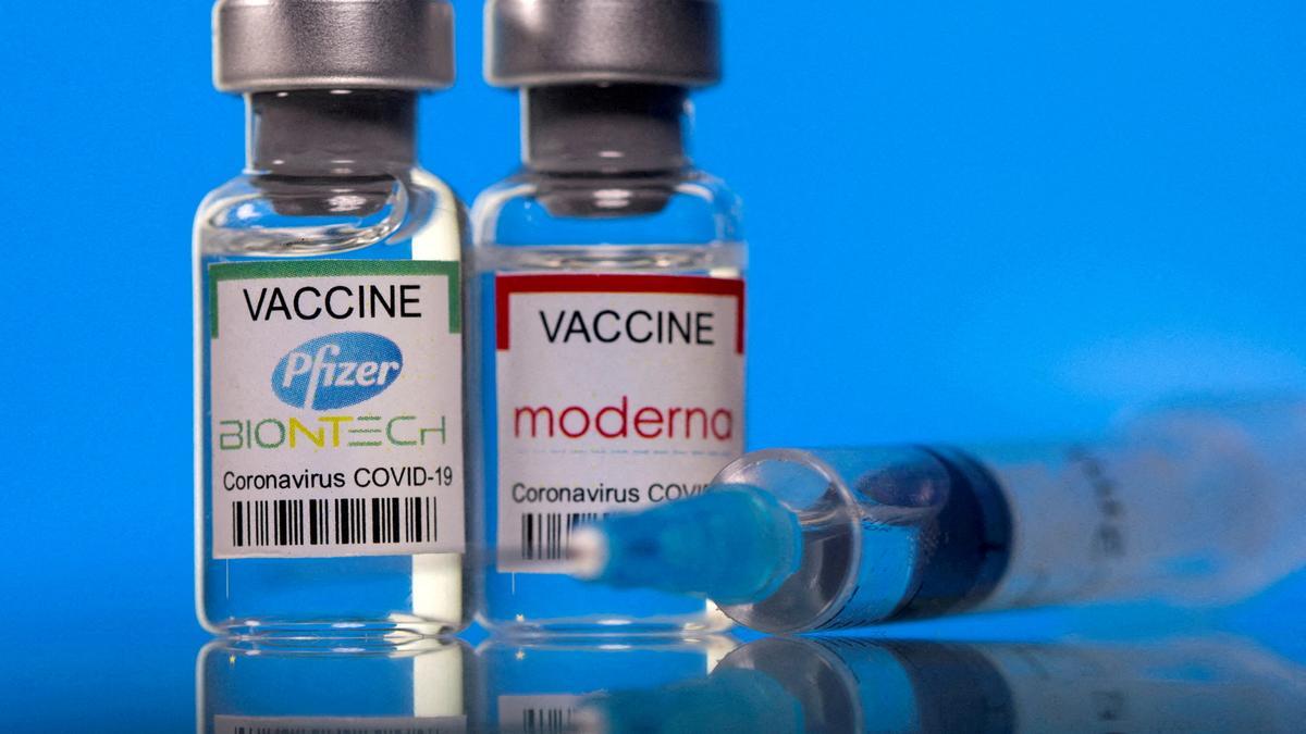 FILE PHOTO: Picture illustration of vials with Pfizer-BioNTech and Moderna coronavirus disease (COVID-19) vaccine labels