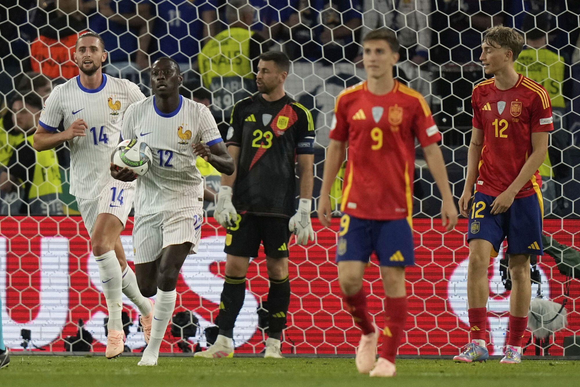 France's Randal Kolo Muani brings the ball to the center after he scored during the Nations League semifinal soccer match between Spain and France in Stuttgart, Germany, Thursday, June 5, 2025. (AP Photo/Matthias Schrader)
