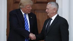 FILE - In this Nov. 19, 2016, file photo, President-elect Donald Trump shakes hands with retired Marine Corps Gen. James Mattis as he leaves Trump National Golf Club Bedminster clubhouse in Bedminster, N.J. Trump said at a rally on Dec. 1, that he will nominate Mattis as defense secretary. (AP Photo/Carolyn Kaster, File)