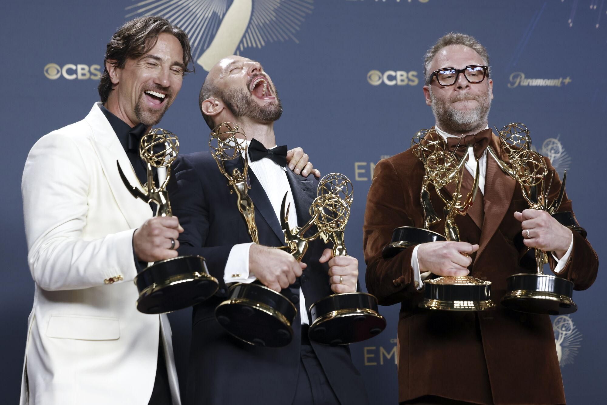 LOS ANGELES (United States), 15/09/2025.- (L-R) James Weaver, winner of the award for outstanding comedy series, Evan Goldberg, winner of the awards for outstanding directing for a comedy series, outstanding writing for a comedy series, and outstanding comedy series, and Seth Rogen, winner of the awards for outstanding lead actor in a comedy series, outstanding directing for a comedy series, outstanding writing for a comedy series, and outstanding comedy series for 'The Studio' pose in the press room during the 77th annual Emmy Awards ceremony held at the Peacock Theater in Los Angeles, California, USA, 14 September 2025. The Emmys celebrate excellence in national primetime television programming. EFE/EPA/CAROLINE BREHMAN
