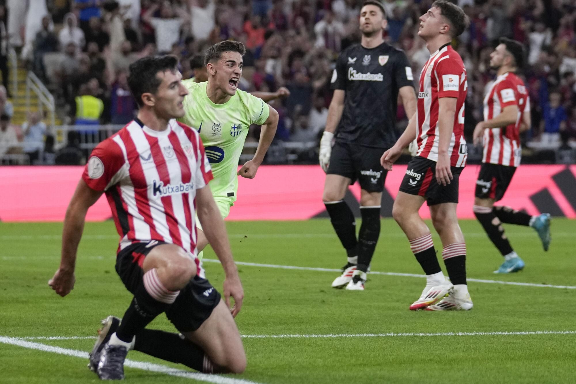 Barcelona's Gavi, center, celebrates after scoring during the Spanish Super Cup semifinal match between Athletic Bilbao and Barcelona in Jeddah, Saudi Arabia, on Wednesday, Jan. 8, 2025. (AP Photo/Altaf Qadri)