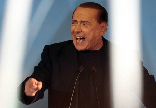 Former Prime Minister Silvio Berlusconi gestures during a speech in Rome