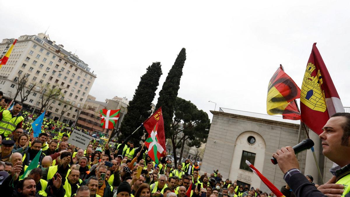 FILE PHOTO: Striking truck drivers and supporters protest over high fuel prices and working conditions, in Madrid