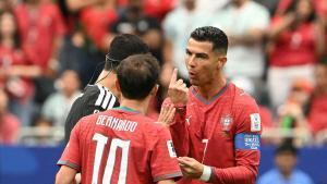 Portugals forward #07 Cristiano Ronaldo (R) speaks with Qatari referee Abdulrahman Al-Jassim during the 2026 World Cup Group K football match between Portugal and the Democratic Republic of Congo at the Houston Stadium in Houston on June 17, 2026. (Photo by RONALDO SCHEMIDT / AFP)