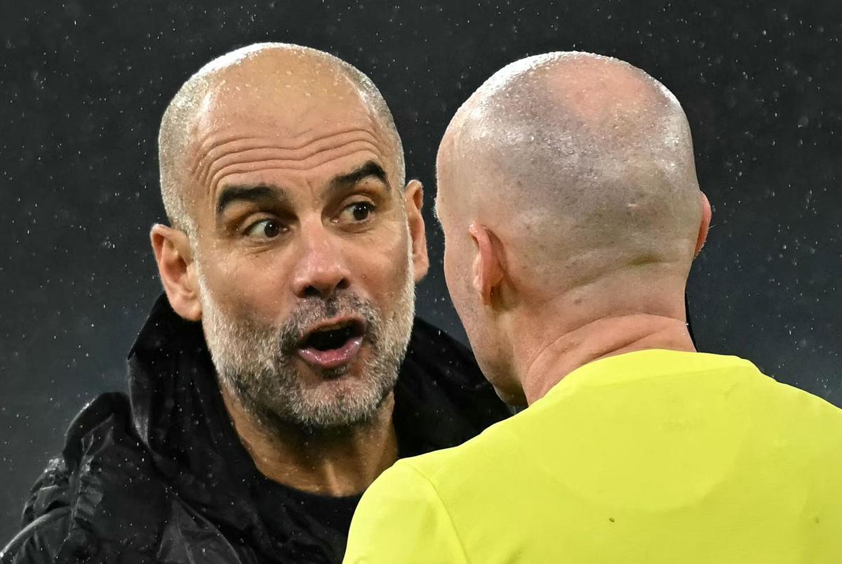 Manchester City's Spanish manager Pep Guardiola reacts as she talks with Referee Paul Tierney following the English Premier League football match between Manchester City and Fulham at the Etihad Stadium in Manchester, north west England, on February 11, 2026. (Photo by Paul ELLIS / AFP) / RESTRICTED TO EDITORIAL USE. No use with unauthorized audio, video, data, fixture lists, club/league logos or 'live' services. Online in-match use limited to 120 images. An additional 40 images may be used in extra time. No video emulation. Social media in-match use limited to 120 images. An additional 40 images may be used in extra time. No use in betting publications, games or single club/league/player publications. /. SEE CAPTION FOR MORE INFORMATION / RESTRICTED TO EDITORIAL USE. No use with unauthorized audio, video, data, fixture lists, club/league logos or 'live' services. Online in-match use limited to 120 images. An additional 40 images may be used in extra time