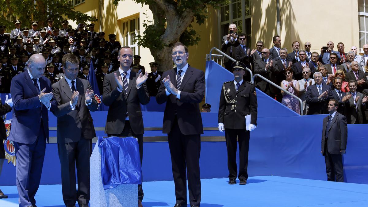 De izquierda a derecha Jorge Fernández Díaz, Ignacio Cosidó, Francisco Martínez y Mariano Rajoy en un acto celebrado en 2014