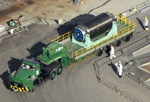 The cask containing 22 fuel rods at the No. 4 reactor building on a trailer, is moved from the reactor building to another building where a common fuel pool is located, at the tsunami-crippled TEPCO's Fukushima Daiichi nuclear power plant