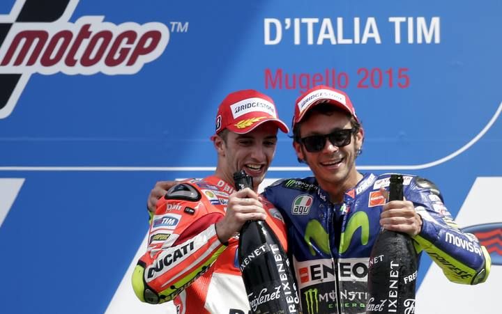 Yamaha MotoGP rider Rossi of Italy celebrates with his compatriot Ducati MotoGP rider Iannone on the podium after the Italian Grand Prix at the Mugello circuit,