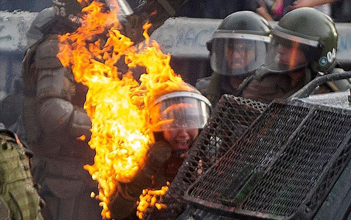 zentauroepp50752538 topshot   a riot police officers is reached by a petrol bomb191105111245