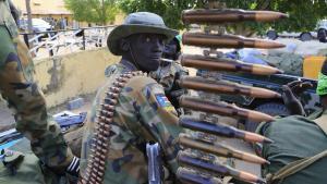 A South Sudan army soldier stands next to a machine gun mounted on a truck in Malakal town, 497km (308 miles) northeast of capital Juba, December 30, 2013 a few days after retaking the town from rebel fighters. South Sudanese troops clashed with ethnic Nuer White Army militia and other rebel factions loyal to former Vice President Riek Machar late on Monday near the flashpoint town of Bor, government officials said.  REUTERS/James Akena (SOUTH SUDAN - Tags: POLITICS CIVIL UNREST MILITARY CONFLICT)