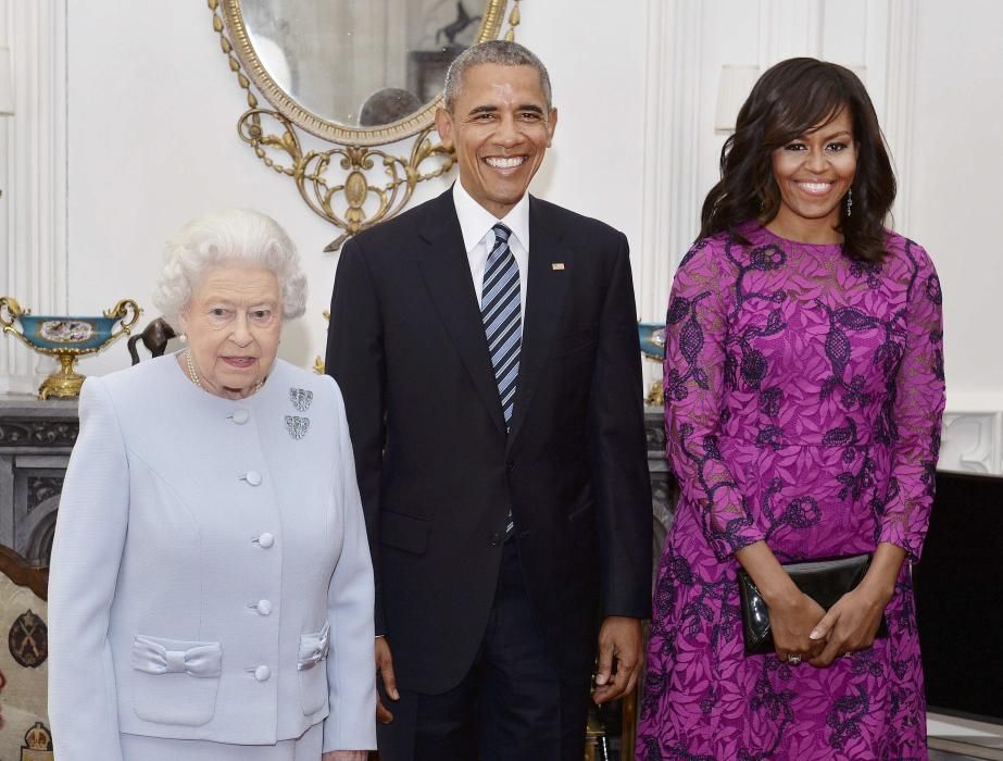 Queen Elizabeth II  (left) stands with the ...