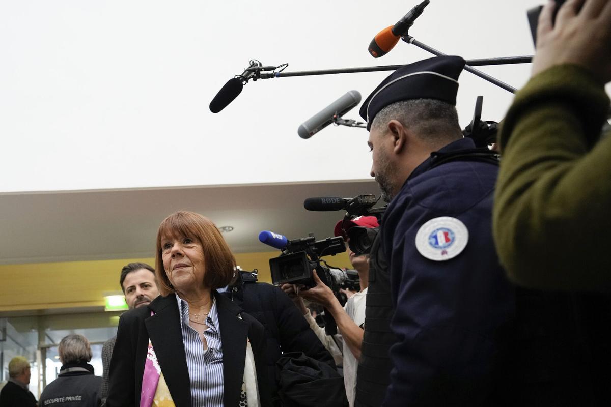 Gisele Pelicot, who was allegedly drugged by her now former husband so that he and others could assault her, arrives at the court house in Avignon, southern France, Thursday, Dec. 19, 2024. (AP Photo/Lewis Joly)
