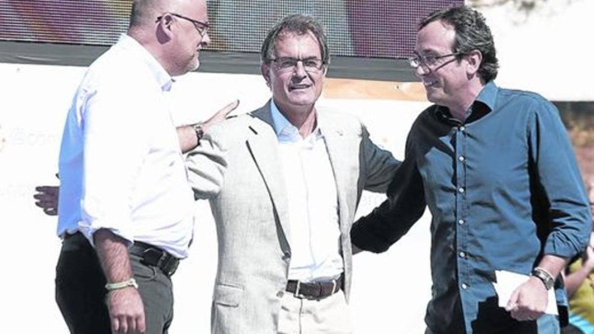 Lluís Corominas, Artur Mas y Josep Rull, en un acto de CDC el pasado año en Igualada.