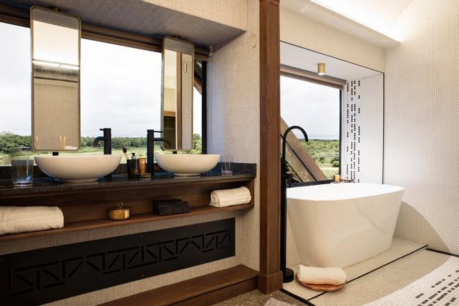 Baño habitación tren hotel Kruger Shelati