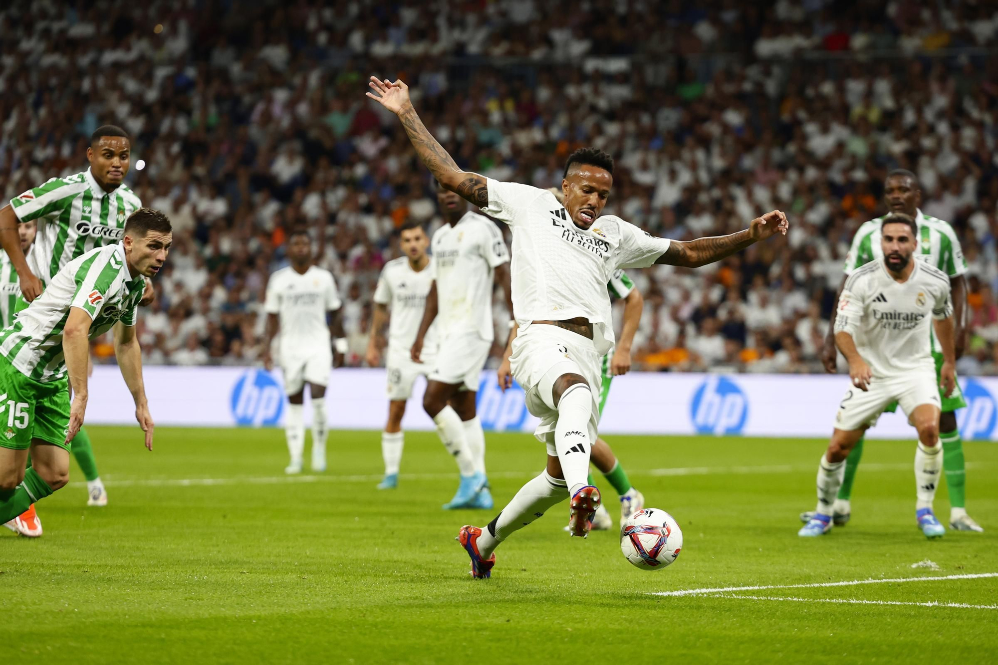 Real Madrid's Eder Militao tries to control the ball during the Spanish La Liga soccer match between Real Madrid and Betis at the Santiago Bernabeu stadium in Madrid, Spain, Sunday, Sept. 1, 2024. (AP Photo/Pablo Garcia)
