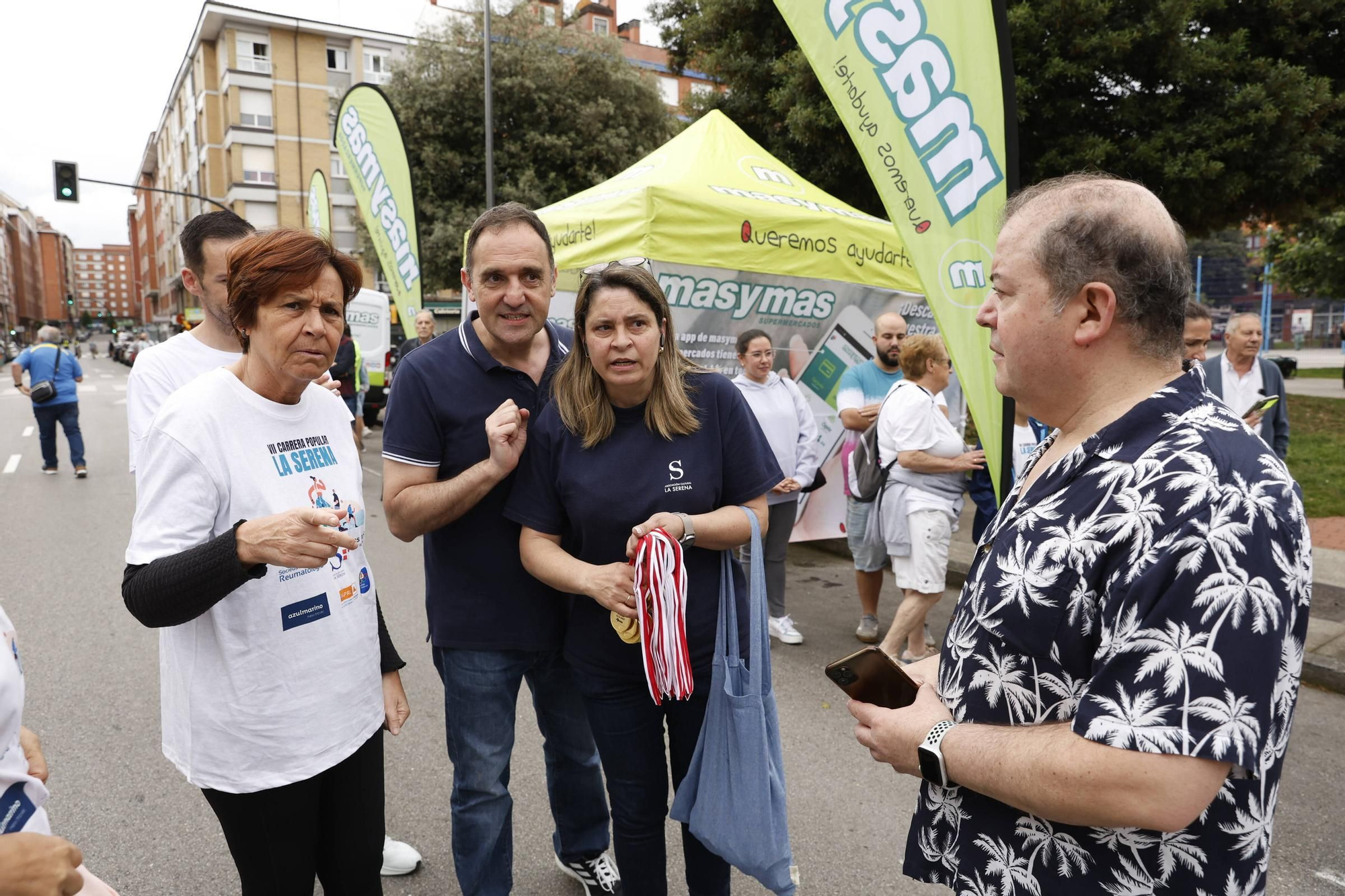 La carrera popular solidaria en El Llano, en Gijón, en imágenes