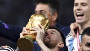 Lionel Messi of Argentina holding the World Cup and teammates celebrate during the trophy ceremony following the FIFA World Cup 2022, Final football match between Argentina and France on December 18, 2022 at Lusail Stadium in Al Daayen, Qatar - Photo Jean
