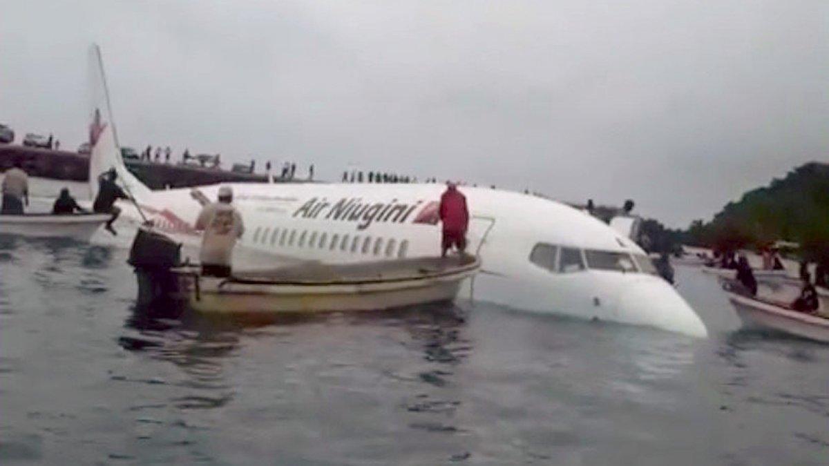 A view of the crashed Air Niugini plane with people rescuing passengers in Weno, Chuuk, Micronesia September 28, 2018 in this still image obtained from social media. JUMETA ESENAF/via REUTERS THIS IMAGE HAS BEEN SUPPLIED BY A THIRD PARTY. MANDATORY CREDIT. NO RESALES. NO ARCHIVES