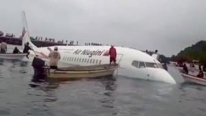 A view of the crashed Air Niugini plane with people rescuing passengers in Weno, Chuuk, Micronesia September 28, 2018 in this still image obtained from social media. JUMETA ESENAF/via REUTERS THIS IMAGE HAS BEEN SUPPLIED BY A THIRD PARTY. MANDATORY CREDIT. NO RESALES. NO ARCHIVES