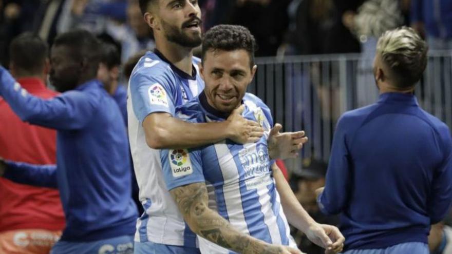 Luis Muñoz y Rubén Castro celebran uno de los goles.