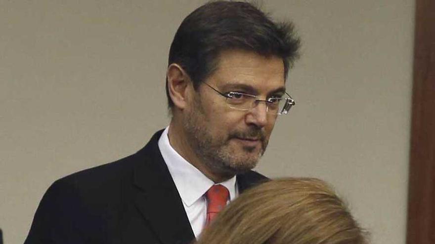 Rafael Catalá, detrás de la vicepresidenta Sáenz de Santamaría.