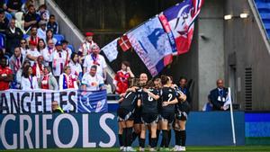 Arsenals players celebrate after scoring a goal during the UEFA Womens Champions League semi-final second leg football match between Lyon and Arsenal at the Groupama Stadium in Decines-Charpieu, central-eastern France on April 27, 2025. (Photo by OLIVIER CHASSIGNOLE / AFP)