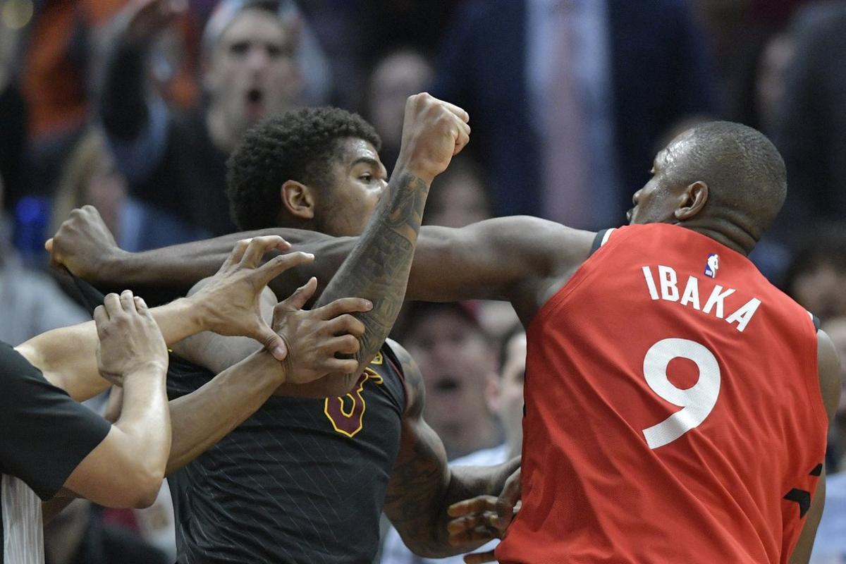 Mar 11, 2019; Cleveland, OH, USA; Cleveland Cavaliers forward Marquese Chriss (3) and Toronto Raptors center Serge Ibaka (9) throw punches in the third quarter at Quicken Loans Arena. Both players were ejected. Mandatory Credit: David Richard-USA TODAY Sports