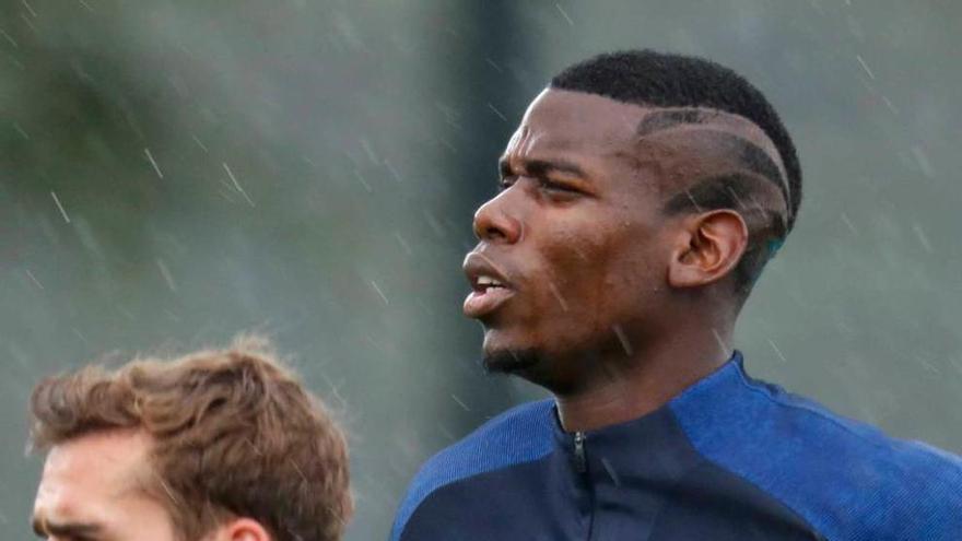 Griezmann y Pogba, ayer, durante el entrenamiento de Francia.