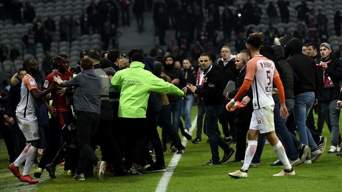 marcosl42468994 lille s supporters invade the pitch  at the end of the frenc180312181806