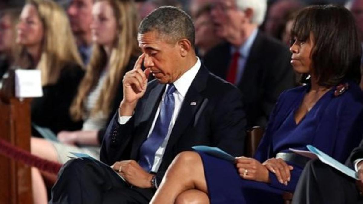 Obama, en el servicio religioso junto a su esposa, Michelle.
