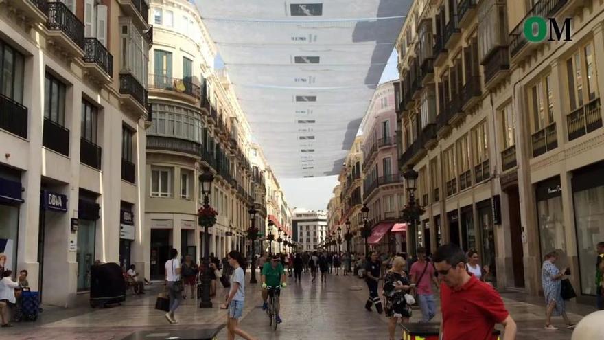 Los toldos de la calle Larios comienzan a dar sombra