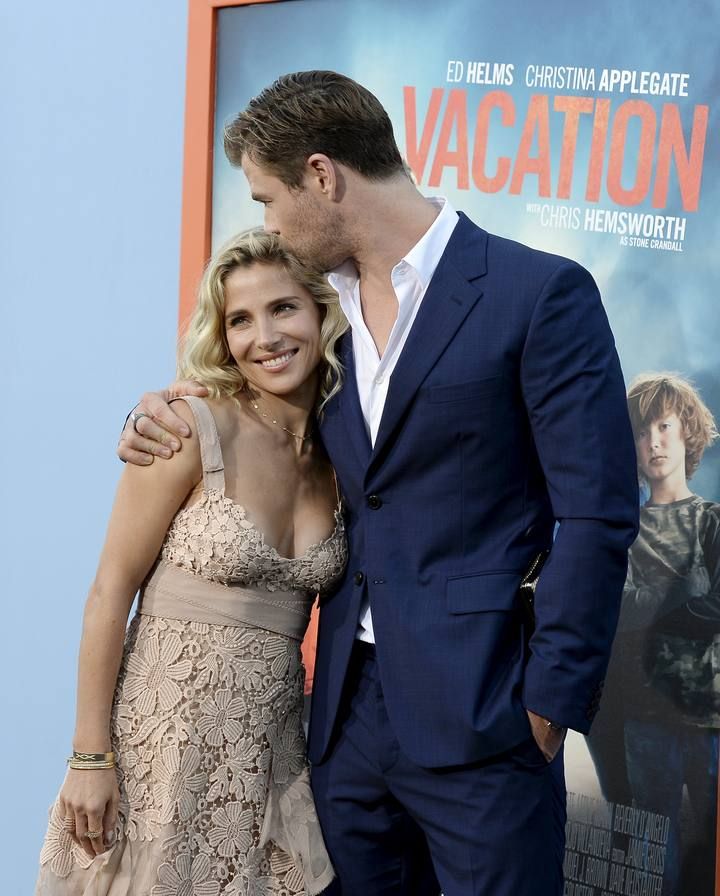 Cast member Chris Hemsworth kisses model Elsa Pataky as they pose during the premiere of the film "Vacation" at the Regency Village Theatre in the Westwood section of Los Angeles