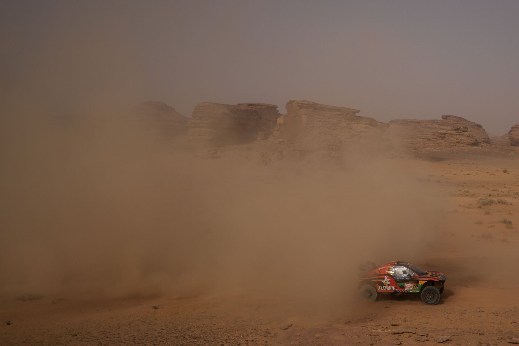 Driver Yongming Tao and co-driver Liguo Fu compete during the third stage of the Dakar Rally with a start and finish in Alula, Saudi Arabia, Tuesday, Jan. 6, 2026. (AP Photo/Thibault Camus)