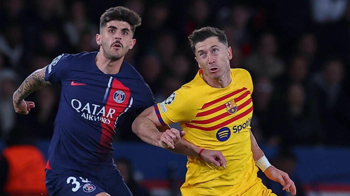 Lucas Beraldo con Robert Lewandowski en un partido PSG-Barça de Champions