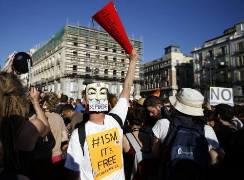 Demonstrators shout slogans in the Puerta del Sol on the second anniversary of the 15M movement in central Madrid