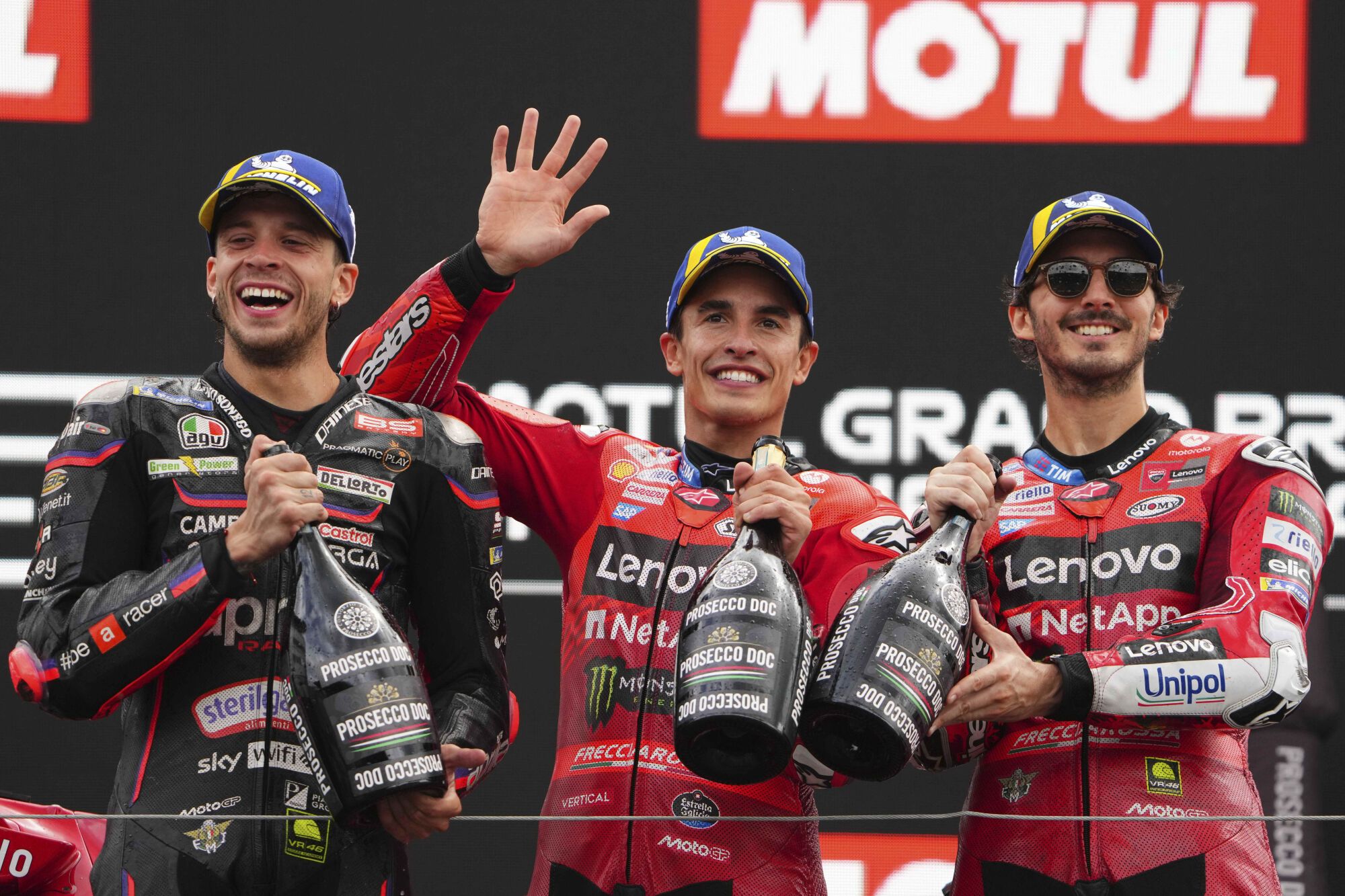 Race winner Spain's rider Marc Marquez of the Ducati Lenovo Team, center, poses with second placed Italian rider Marco Bezzecchi of the Aprilia Racing, left, and third placed Italian rider Francesco Bagnaia of the Ducati Lenovo Team after winning the MotoGP race at the Grand Prix of the Netherlands at the TT Circuit in Assen, northern Netherlands, Sunday, June 29, 2025. (AP Photo/Peter Dejong) Associated Press/LaPresse. EDITORIAL USE ONLY/ONLY ITALY AND SPAIN