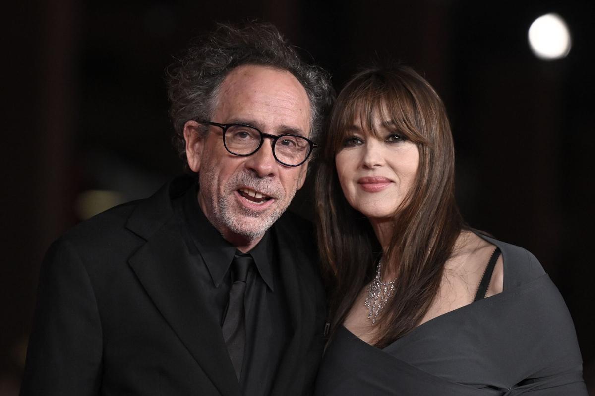 (FILES) Italian actress Monica Bellucci (R) and partner US director Tim Burton attend the red carpet of the movie "Diabolik chi sei ?" presented at the 18th Rome Film Festival on October 19, 2023 in Rome. Tim Burton and Monica Bellucci announced their separation in a statement on September 19, 2025. (Photo by Tiziana FABI / AFP)
