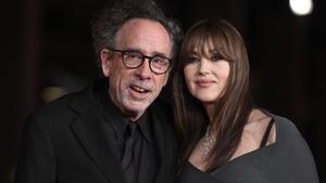 (FILES) Italian actress Monica Bellucci (R) and partner US director Tim Burton attend the red carpet of the movie Diabolik chi sei ? presented at the 18th Rome Film Festival on October 19, 2023 in Rome. Tim Burton and Monica Bellucci announced their separation in a statement on September 19, 2025. (Photo by Tiziana FABI / AFP)