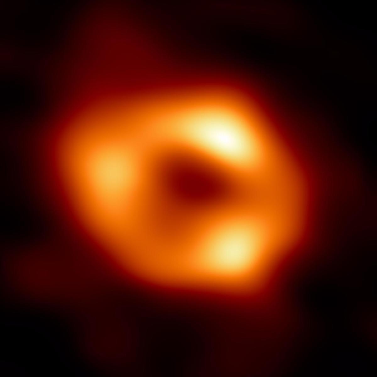 - (-), 12/05/2022.- A handout photo from Event Horizon Telescope (EHT) Collaboration provided on 12 May 2022, shows the first image of Sagittarius A*, or Sgr A*, the supermassive black hole at the center of the Milky Way galaxy and is comprised of an average of the different images that the EHT Collaboration has extracted from observations taken in 2017.It was captured by the Event Horizon Telescope (EHT), an array which links together eight existing radio observatories across the planet to form a single Earth-sized virtual telescope. Although the event horizon itself is not visible, because it cannot emit light, glowing gas orbiting around the black hole reveals a telltale signature: a dark central region, called a ’shadow,’ surrounded by a bright ring-like structure. The new view captures light bent by the powerful gravity of the black hole, which is 4 million times more massive than the sun. (Estados Unidos) EFE/EPA/EVENT HORIZON TELESCOPE COLLABORATION HANDOUT HANDOUT EDITORIAL USE ONLY / NO SALES HANDOUT EDITORIAL USE ONLY/NO SALES