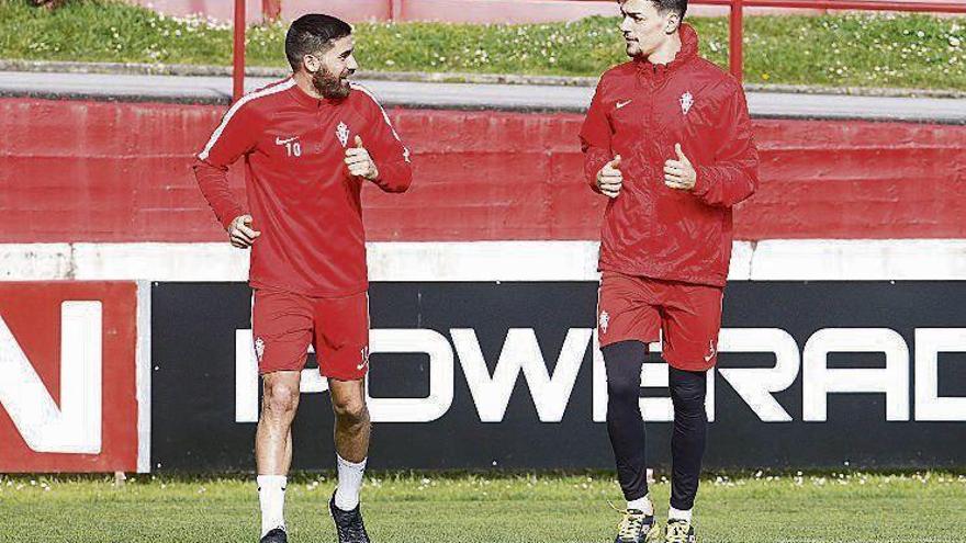 Carmona y Barba charlan en el entrenamiento del lunes en Mareo.