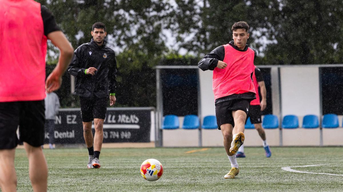 Germán Lidón y Marc Abril en un entrenamiento bajo la lluvia.