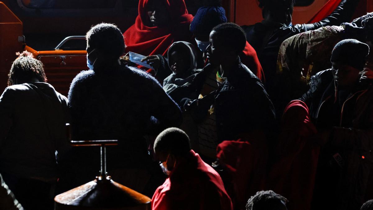 Migrants wait to disembark from a Spanish coast guard vessel, in the port of Arguineguin, in the island of Gran Canaria, Spain, March 10, 2023. REUTERS/Borja Suarez