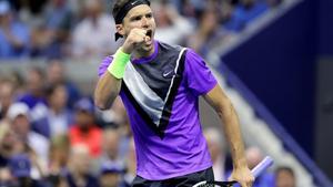 NEW YORK, NEW YORK - SEPTEMBER 03: Grigor Dimitrov of Bulgaria celebrates after winning the second set during his Men’s Singles quarterfinal match against Roger Federer of Switzerland on day nine of the 2019 US Open at the USTA Billie Jean King National Tennis Center on September 03, 2019 in the Queens borough of New York City.   Elsa/Getty Images/AFP
