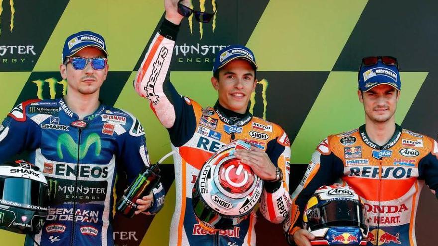 Lorenzo, Márquez y Pedrosa posan tras lograr ayer las tres primeras plazas en la clasificación de MotoGP.