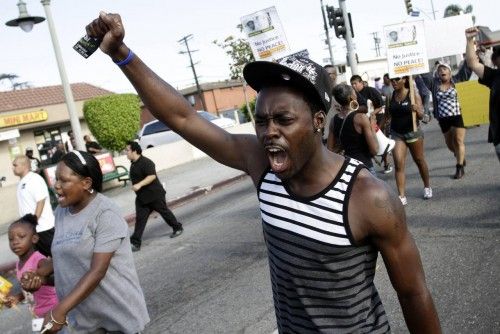 A man shouts during a protest march against the acquittal of George Zimmerman in the Trayvon Martin trial, in Los Angeles