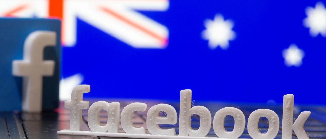 FILE PHOTO: A 3D printed Facebook logo is seen in front of displayed Australia&#039;s flag in this illustration photo