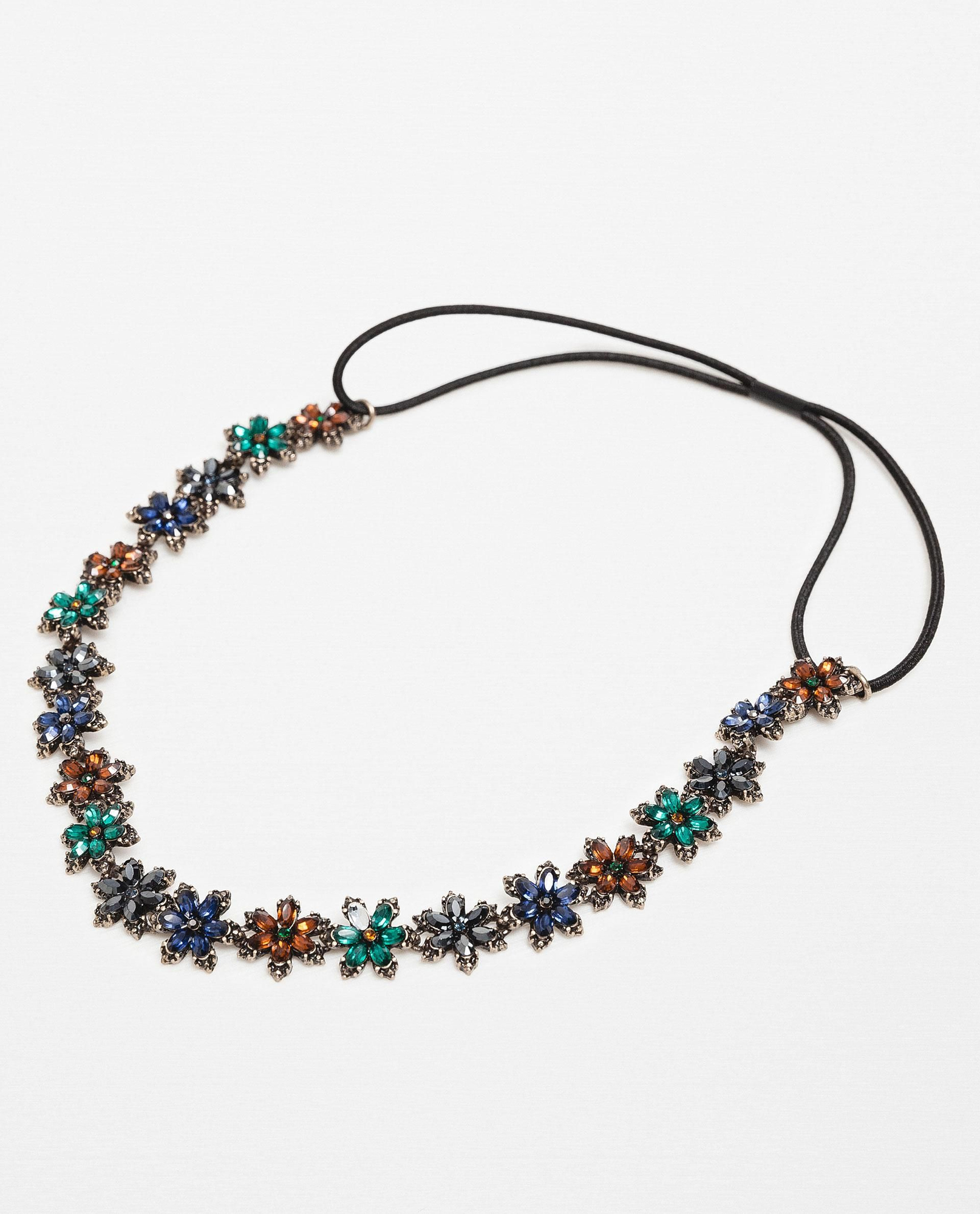 Diadema con flores de colores de Zara (9,95€)